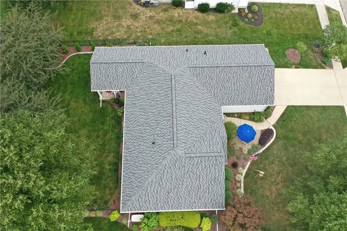 New gray roof on a T-shaped ranch home